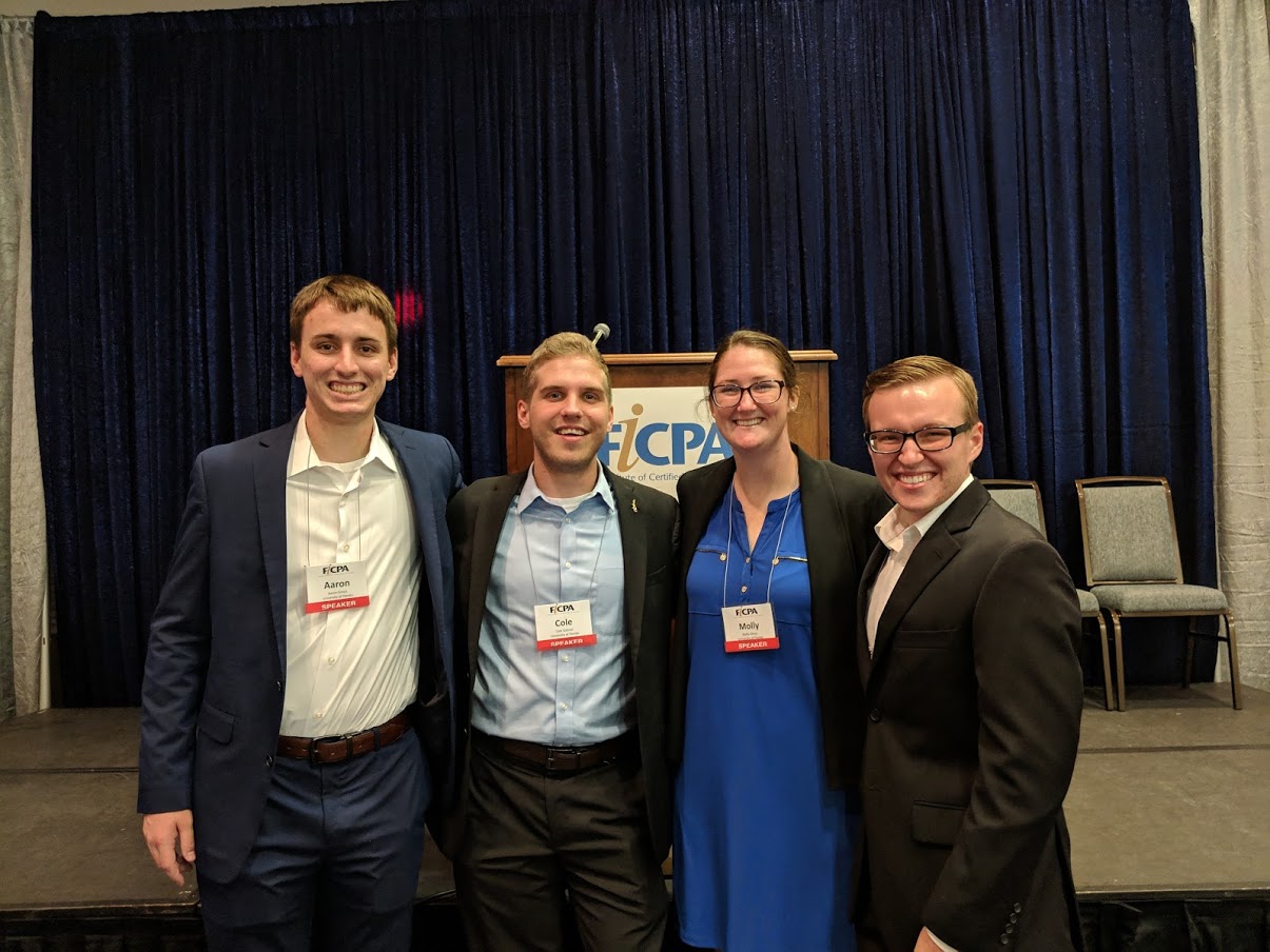 Cole standing with his 3 fellow FICPA presenters