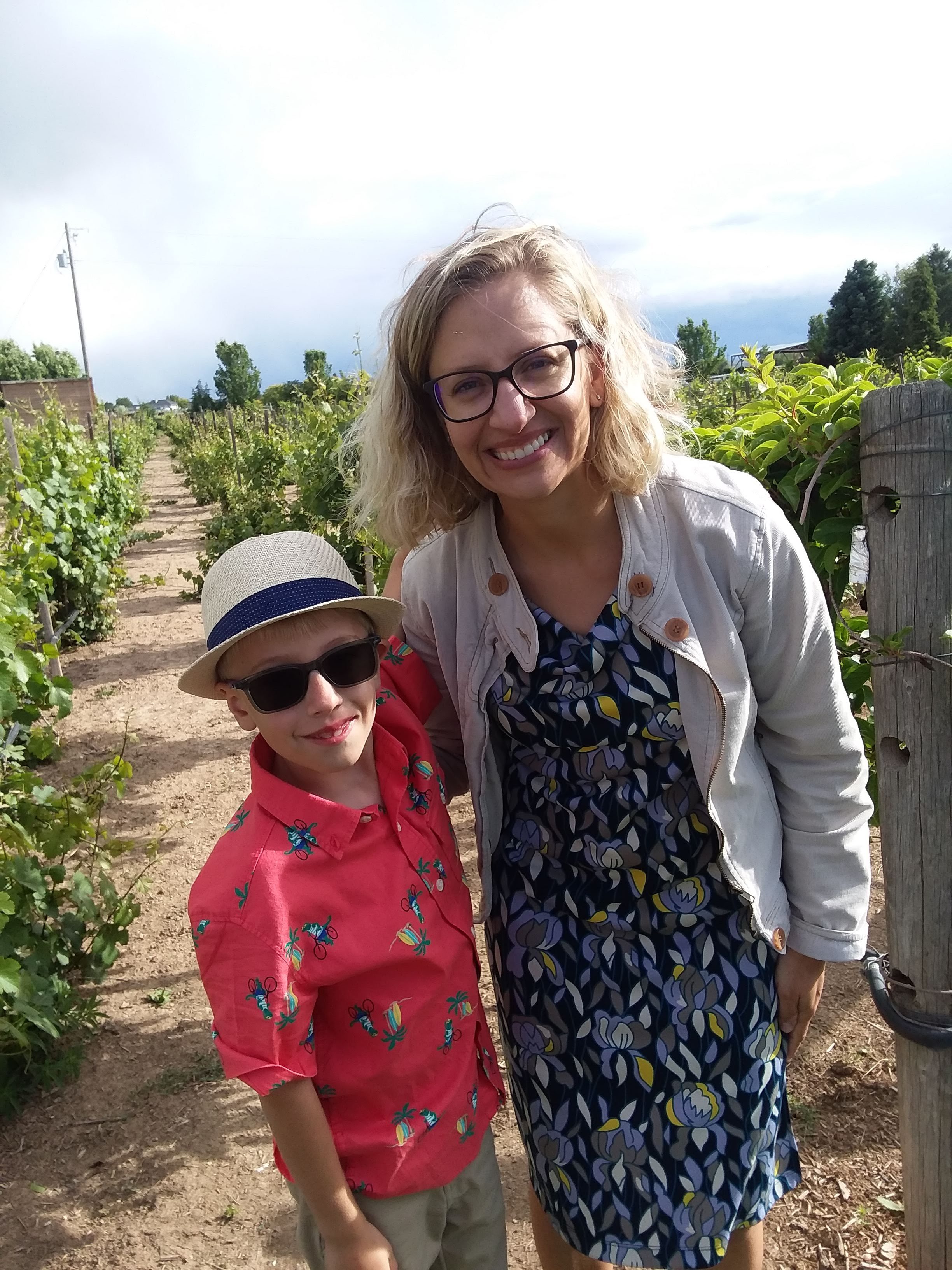 Casie Cook visits a farm with her son.
