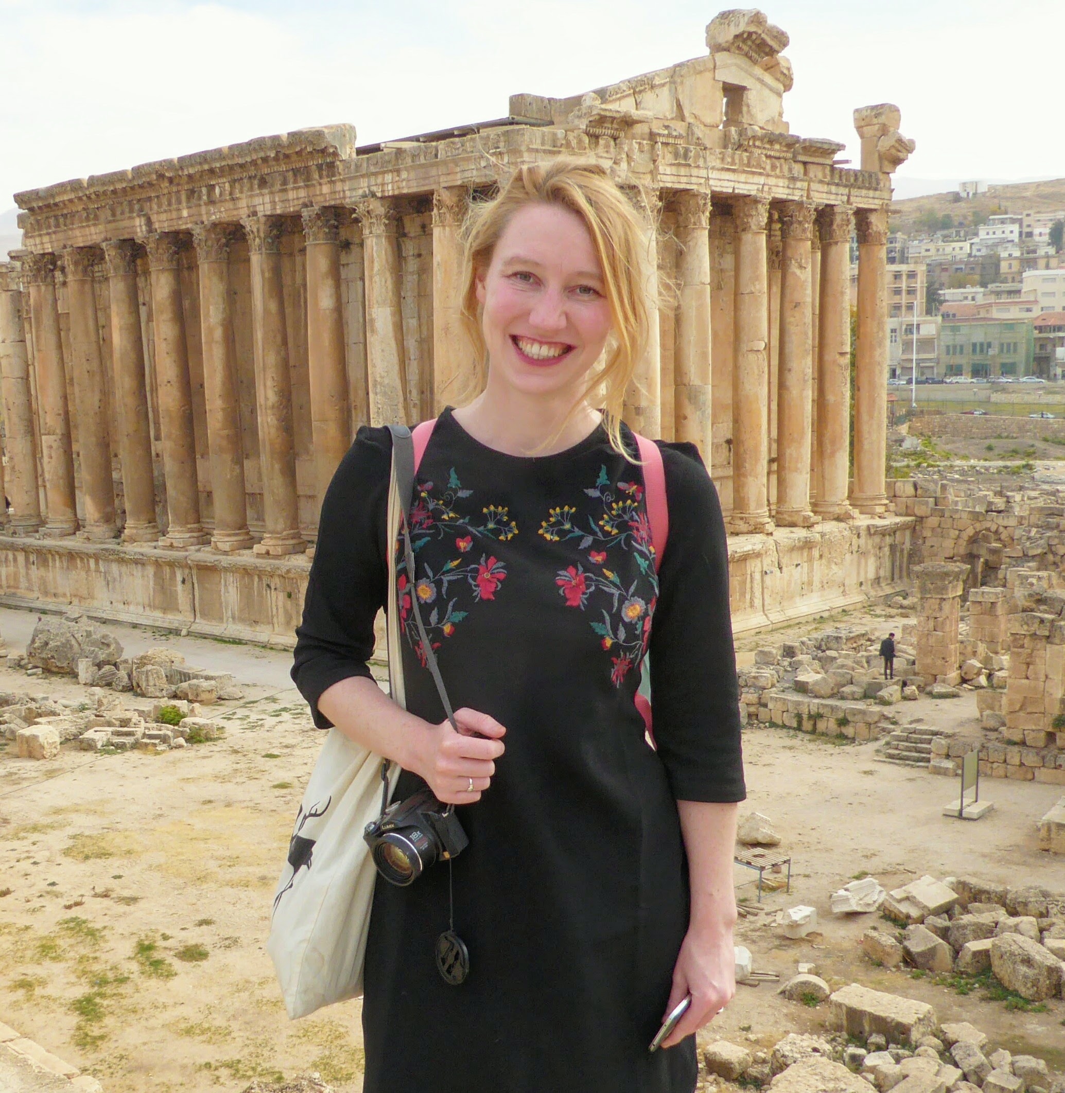 Brigitte de Graaff stands in front of Greek Parthenon