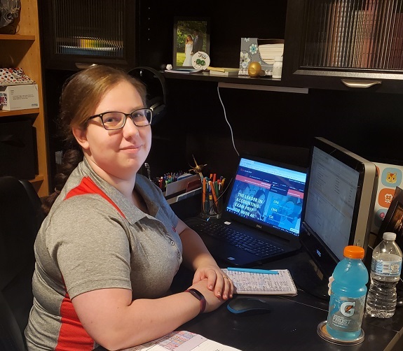 Gleim Personal Counselor Soncera Keene smiling at her desk at home during COVID-19